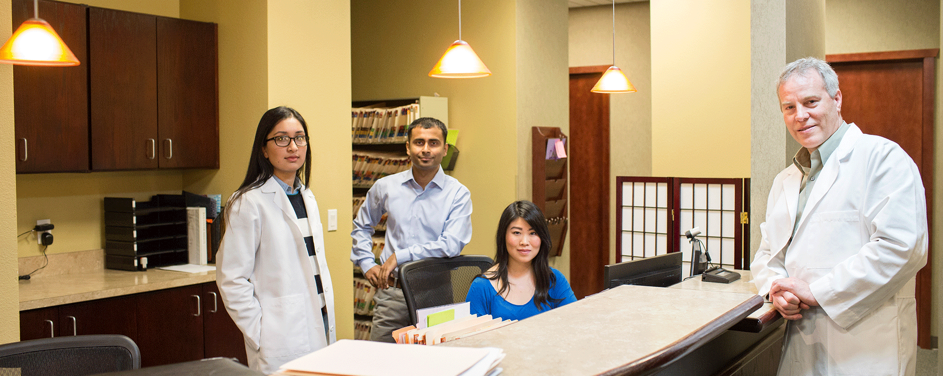 Dr Deborah Blades smiling in a medical office setting with soft natural light and welcoming atmosphere text reads Expert Spine and Orthopedic Care conveying a sense of trust and compassion